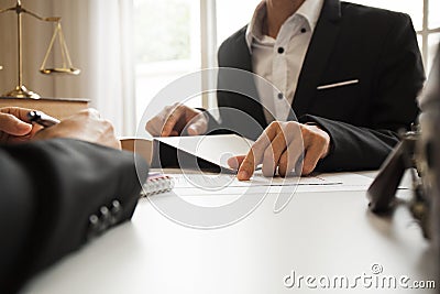 The hard work of an Asian lawyer in a lawyer`s office. Stock Photo