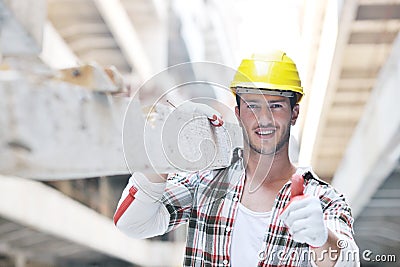 Hard worker on construction site Stock Photo