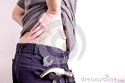 Hard working man with lower back pain Stock Photo