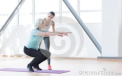 Hard working persistent woman squatting Stock Photo