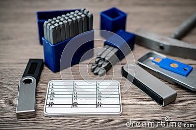Hardware cryptocurrency wallet with metal plates. Safe storage for crypto Stock Photo