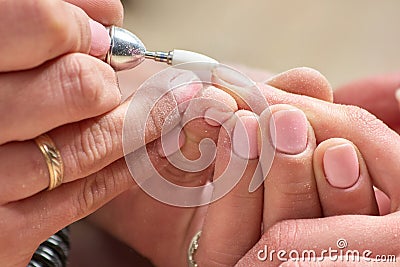 Hardware manicure in beauty salon. Stock Photo