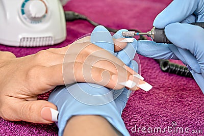 Hardware manicure with using electric machine Stock Photo