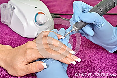 Hardware manicure with using electric machine Stock Photo