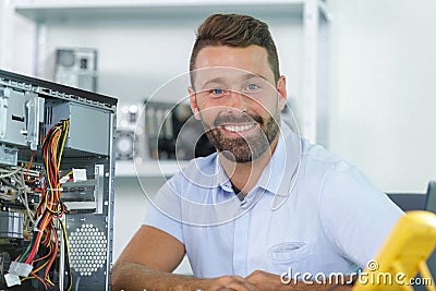 Hardware repairman repairing broken printer fax machine Stock Photo