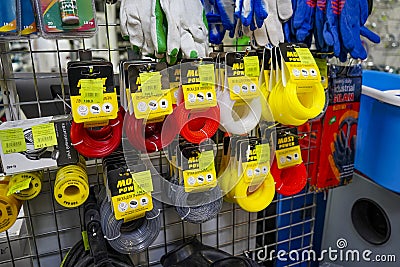 Hardware store. Rack with goods. Trimmer line. Colorful trimmer line cord in warehouse Editorial Stock Photo