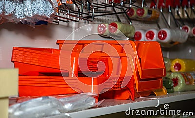 In a hardware store, on a shelf, there is a tray for a roller and paint and equipment for painting works Belarus, Minsk, January Editorial Stock Photo