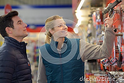 Hardware store worker assisting customer Stock Photo