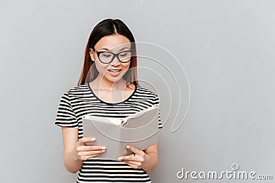 Hardworking student woman reading book isolated Stock Photo