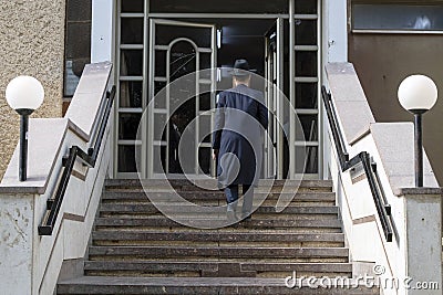 Haredi Charedi orthodox Jewish religious man entering Yeshiva. Editorial Stock Photo