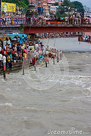 Haridwar, India - August 20, 2009: crowd on the banks of the Ganges for the rite of the sacred bath at Haridwar, Uttarakhand, Editorial Stock Photo