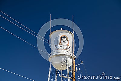 Downtown Harlem Old water tower with art work of Oliver Hardy power lines Editorial Stock Photo