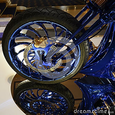 Harley-Davidson Blue Edition Front Wheel with Tire and Disc brake system in blue and gold Editorial Stock Photo