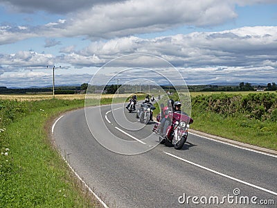 Harley Davidson Motorbikes on a Country Road near to Friockheim in Angus as part of the Brechin Harley Davidson in the City Meet. Editorial Stock Photo