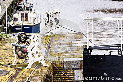 Harlingen, Netherlands - January 10, 2020. Old mechanism for opening lock chamber on water canal Editorial Stock Photo