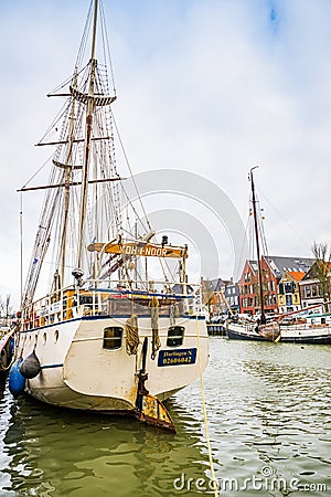 Harlingen, Nethrelands - January 10, 2020. Boats in water canal in downtown in winter Editorial Stock Photo