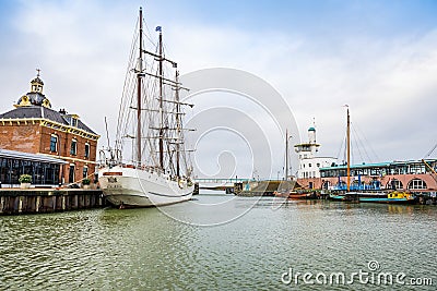 Harlingen, Nethrelands - January 10, 2020. Boats in water canal in downtown in winter Editorial Stock Photo