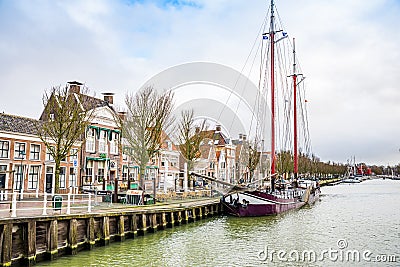 Harlingen, Nethrelands - January 10, 2020. Boats in water canal in downtown in winter Editorial Stock Photo