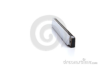 Harmonica, also French harp, blues harp, and mouth organ, isolated on white background. Stock Photo