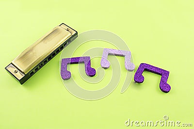 Harmonica with musical notes. Stock Photo