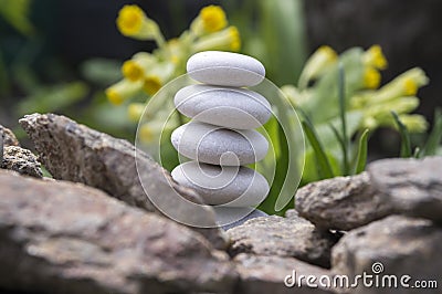 Harmony and balance, simple pebbles tower in another pebbles, simplicity, five stones Stock Photo