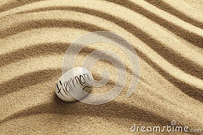 Harmony Pebble on sand Stock Photo