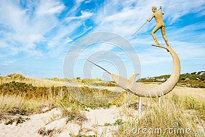 Harpooner sculpture on Martha`s Vineyard New Eng;land by sculptor Jay Lagemann installed in 1994 Editorial Stock Photo