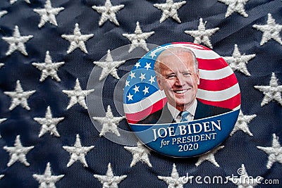 Harrisburg, PA - October 2, 2019 - Joe Biden campaign button against a United States of America flag. Selective focus and depth of Editorial Stock Photo