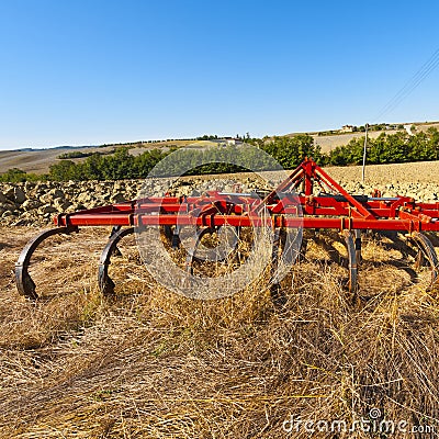 Harrow on the plowed field Stock Photo