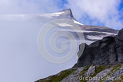 harsh stoney mountain with cold cloud and fog cover Stock Photo