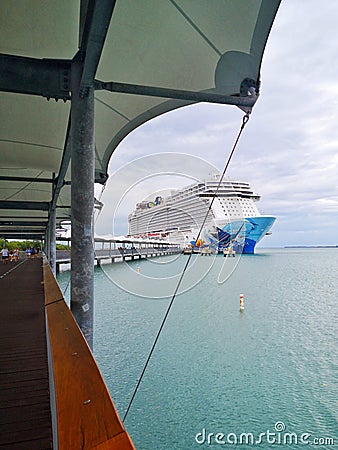 Harvest Caye, Belize - December 3, 2019: Cruise ship staying at Harvest Caye Belize private island port. Beautiful Caribbean Editorial Stock Photo