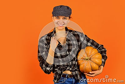 Harvest in garden. Homegrown pumpkin. Organic farming. Family farm. Woman rustic farmer presenting pumpkin. Farming and Stock Photo