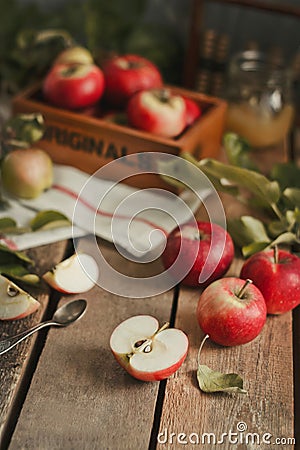 Harvest of red apples on wooden background Stock Photo