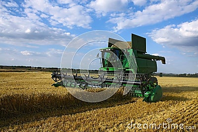 Harvester on agriculture field Stock Photo