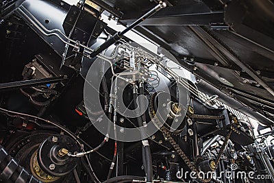 Harvester engine, gear chains, mechanisms transmission of new modern technology combine Stock Photo