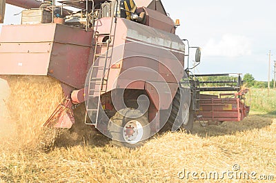 Harvesting of bread by harvesters - harvesting. Stock Photo