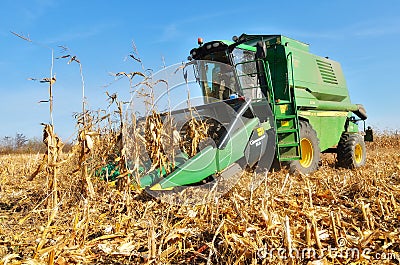 Harvesting the crop with combine Editorial Stock Photo