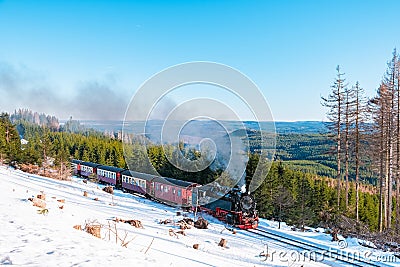 Harz national park Germany, Steam train on the way to Brocken through winter landscape, Famous steam train throught the Editorial Stock Photo