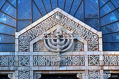 Menorah above the doors of synagogue Stock Photo