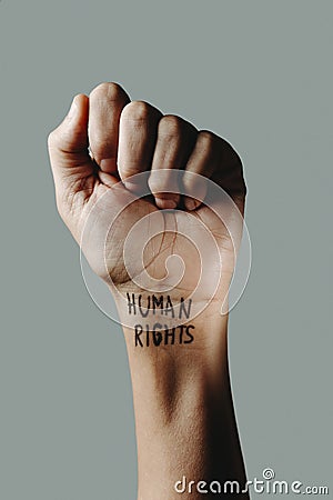 Has the text human rights in his wrist Stock Photo