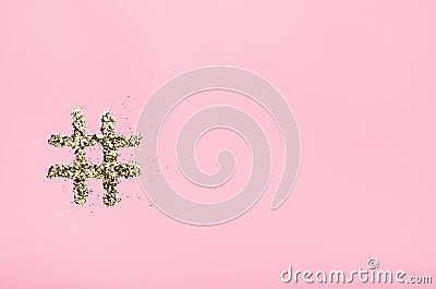 Hashtag from sparkles on a pink background. Online technology concept, creativity, artist, beauty, social media marketing. Copy Stock Photo