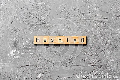 Hashtag word written on wood block. hashtag text on table, concept Stock Photo