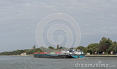 Barge sailing along the channel. Landscape. Copspace Editorial Stock Photo
