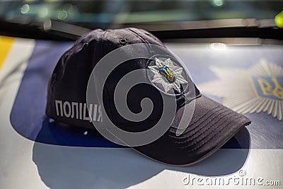 Hat of the ukrainian policeman with sign Police in ukrainian laguage and logo of police department Editorial Stock Photo