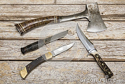 Hatchet hunting knives weathered background Stock Photo