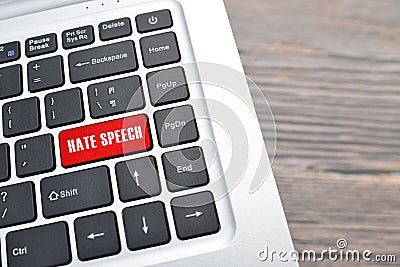 Hate speech key on red keyboard buttons representing online defamatory comments Stock Photo