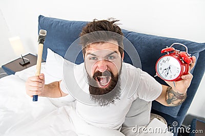 Hateful schedule. Best alarm clocks for people who hate mornings. Man angry hipster hate wake up early. Destructive Stock Photo