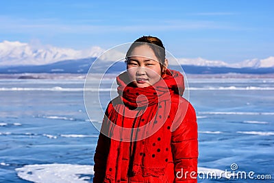 Hatgal, Mongolia, Febrary 23, 2018: mongolian young girl portrait on a frozen lake Khuvsgul Editorial Stock Photo