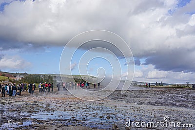 Haukadalur, Iceland: Visitors wait for the active Strokkur geyser to erupt Stock Photo