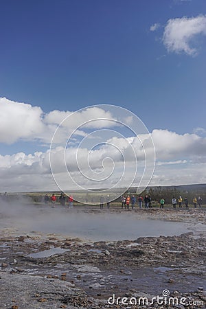 Haukadalur, Iceland: Visitors wait for the active Strokkur geyser to erupt Stock Photo